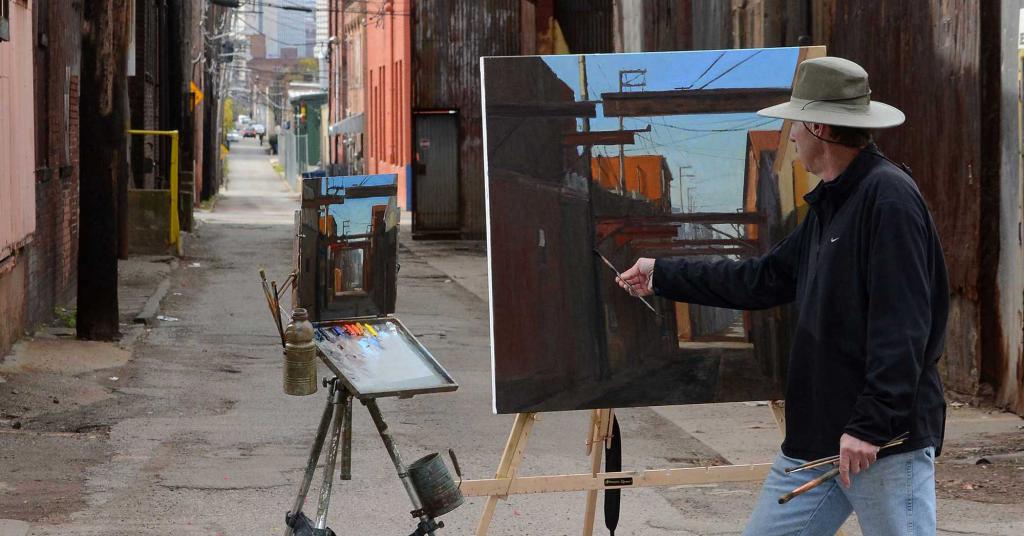 Художник рисующий на улице