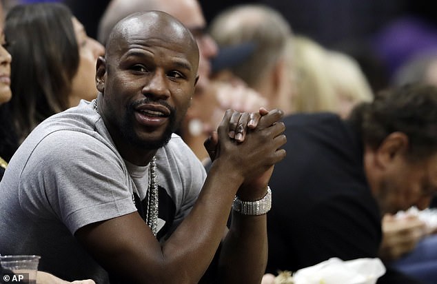 Mayweather was in a relaxed mood at the NBA clash at the Staples Center in Los Angeles