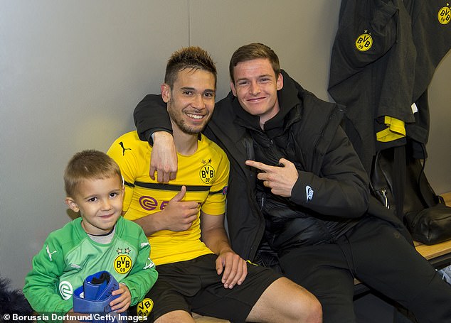 Sergio Gomez with Raphael Guerreiro in the Borussia Dortmund dressing room last season
