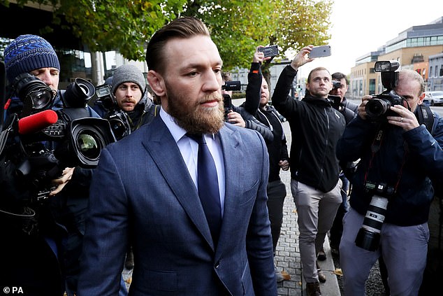 McGregor emerges for court following his arrest for smashing the window of a bus at UFC 223