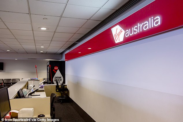 An empty Virgin Australia boarding desk at Melbourne Airport on April 21, 2020 after the airline had announced 1,000 redundancies and stood down 80 percent of its workforce