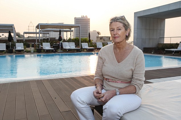 High life: Barbara Jones on one of the luxury hotel terraces that overlook Luanda¿s shanty towns