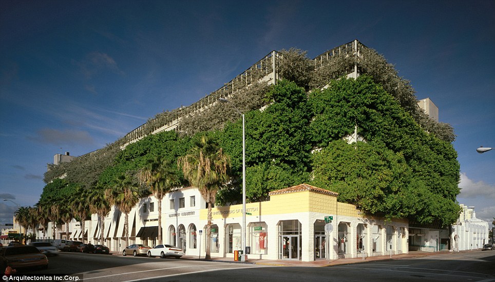 A street-level view of the Ballet Valet Parking Garage in Miami which uses living vegetation to soften the concrete structure and blend in with the surrounding area