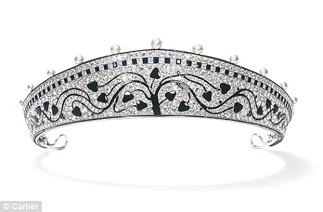 A platinum tiara made by Cartier in 1914 with a tree made from black onyx set against a diamond background