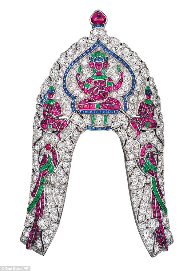 A stunning clip set with diamonds, rubies, sapphires and emeralds by Van Cleef & Arpels transforms an Indian arm jewel into a turban ornament