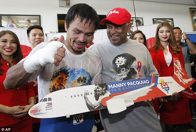 Manny Pacquiao (left) claims Floyd Mayweather has been refusing to agree to a fight