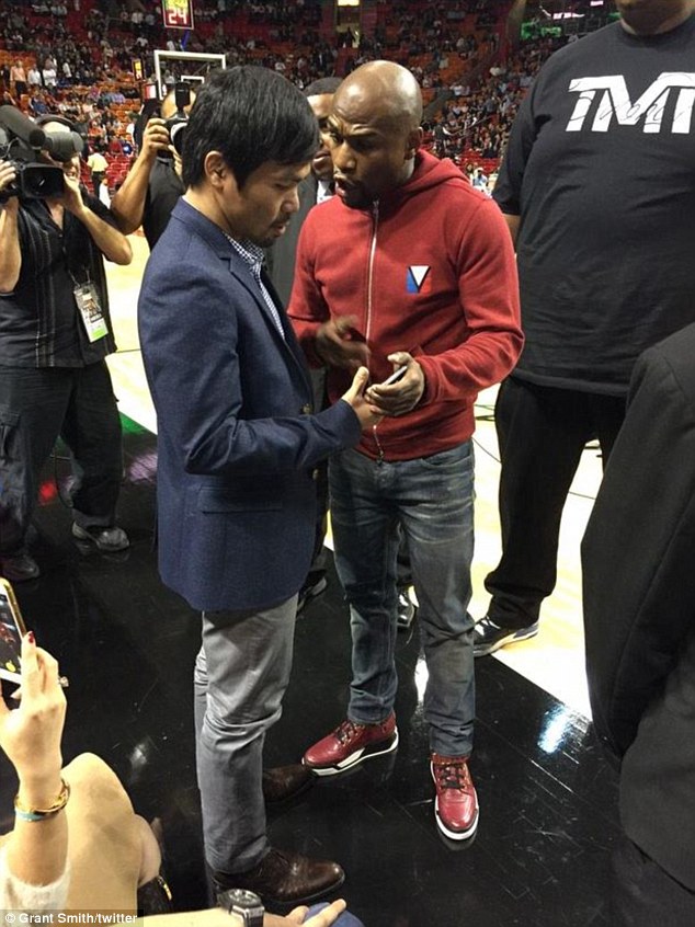 The pair, pictured together for the first time, spoke and swapped phone numbers at the Miami Heat game