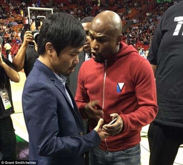 The pair, pictured together for the first time, spoke and swapped phone numbers at the Miami Heat game