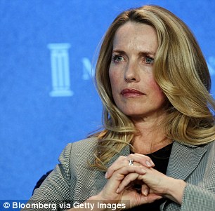 Laurene Powell Jobs, 51 (pictured 2013), inherited shares of Apple and Disney from her late husband