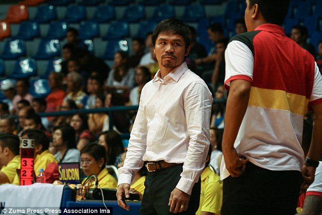 Pacquiao watched his basketball team lose on Sunday before flying to Los Angeles to start his camp