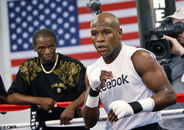 Floyd Mayweather Snr (left) fears his son will end up bankrupt despite his huge fortune