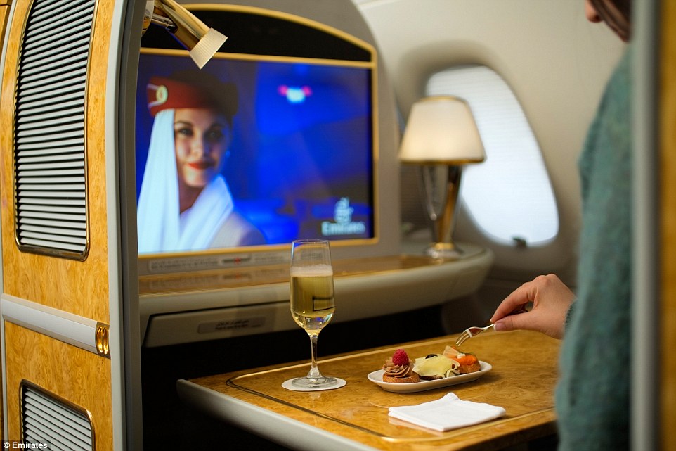 First class passengers with Emirates are afforded a private suite with a seat that converts into a fully-flat bed, plus a personal mini-bar