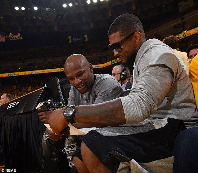 Mayweather joins R&B singer Usher during the Golden State Warriors game with the Cleveland Cavaliers