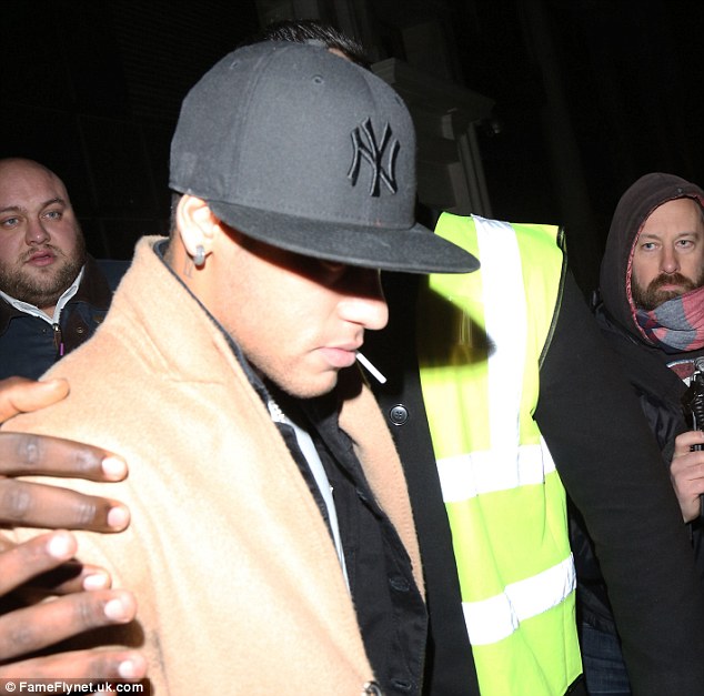 Neymar is pictured leaving the glitzy Libertine nightclub in Oxford Circus following the PFA after party