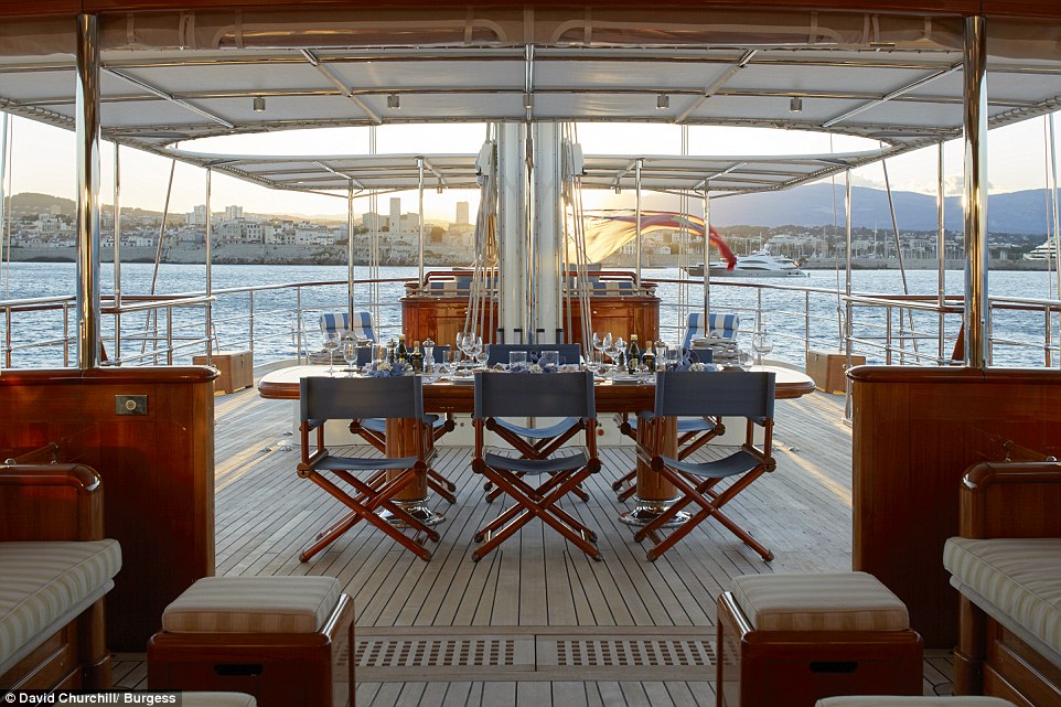 Up on the vast deck a  table is available for al fresco dining as well as numerous individual sun beds, a full tanning bed and a covered area with deck couches