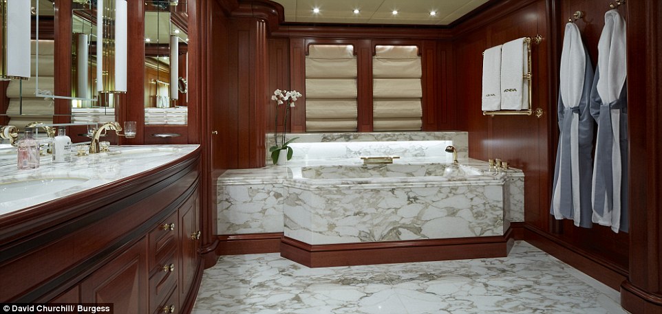 The master suite  boasts a a large marble Jacuzzi tub in the spacious bathroom which also has his