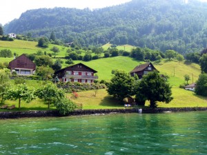 A couple stepping into Lake Lucern from their house