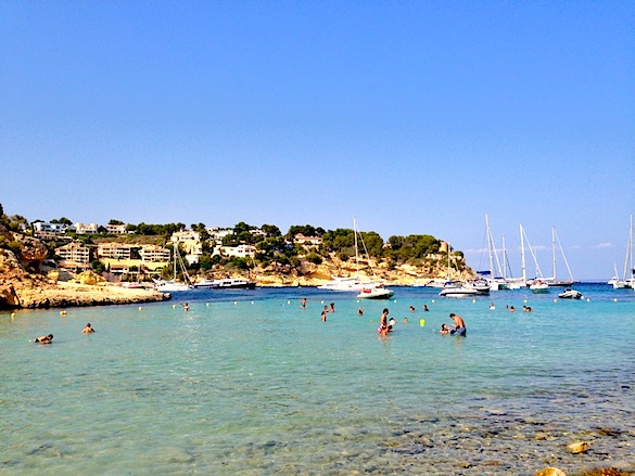 Favorite beach in Mallorca w/ yachts and multi-million dollar homes.