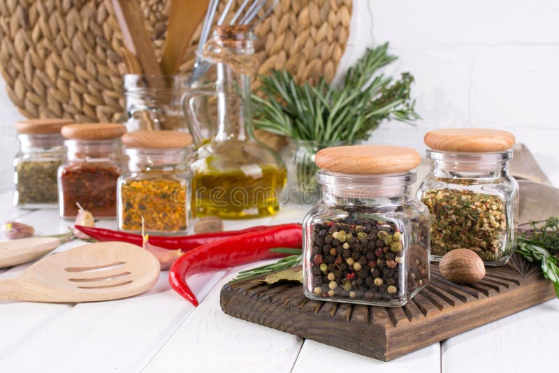 Composition of kitchen tools, spices and herbs on white royalty free stock image