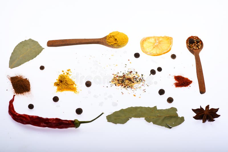 Culinary art concept. Composition of spoons with spices and dried ingredients. Spoons with kitchen herbs, star anise and royalty free stock photography