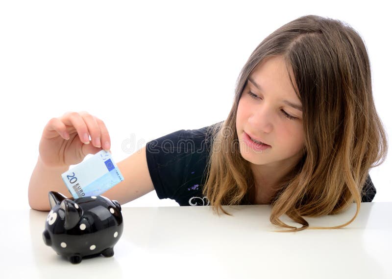 Euro money savings for teenager. Portrait of teenager saving twenty euro in piggybank stock image