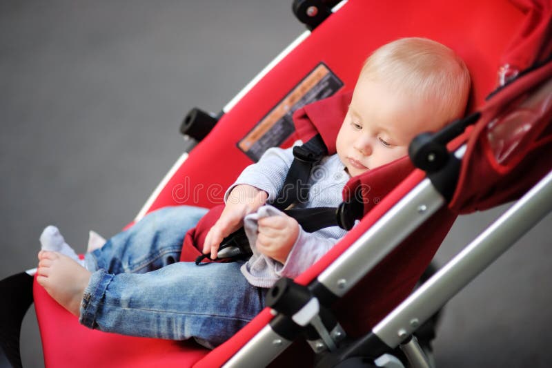 Little baby boy in stroller stock photos