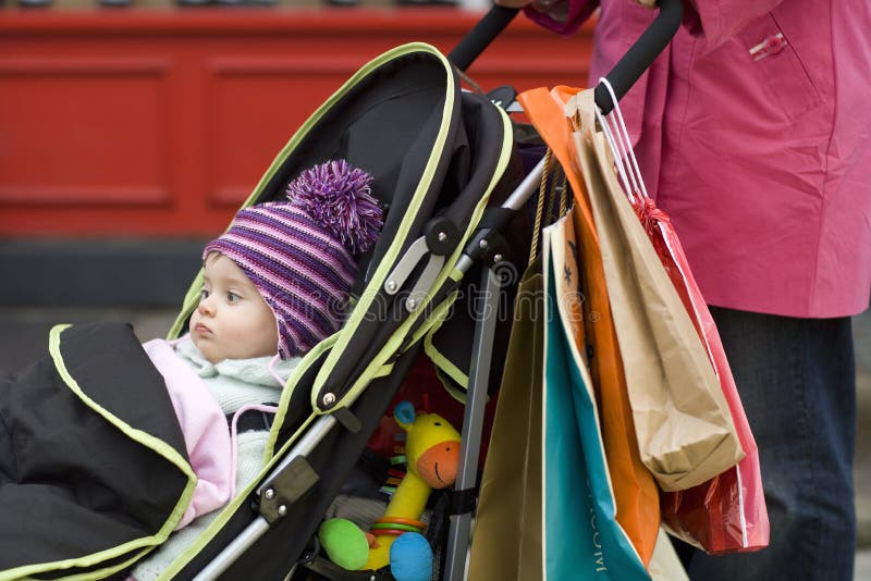 Mother With Cute Baby In Stroller. Midsection of mother with cute baby in stroller stock photography