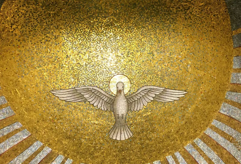 Part of a golden Mosaic inside a cuppola with The Holy Spirit representation as a  white bird with open wings. Part of a golden Mosaic inside a cupola with The royalty free stock photos