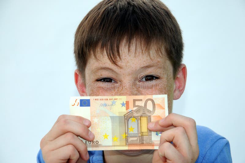 Pocket money. Happy teenager boy, he gets more pocket money stock photo