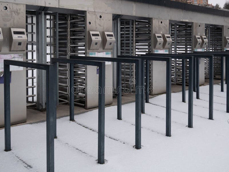 Security entrance with multiply turnstiles metro, stadium. Empty security entrance with multiply turnstiles metro, stadium. outdoor winter shot stock photography