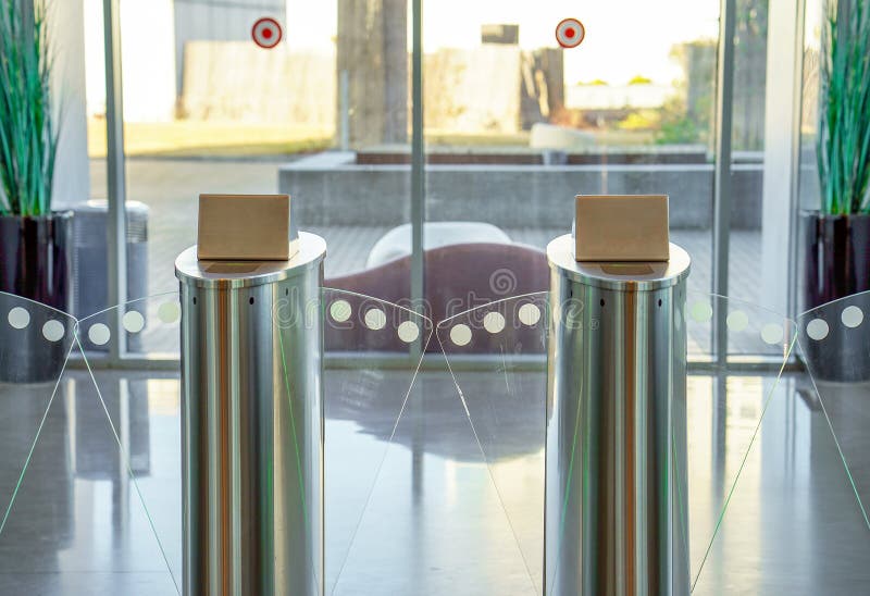 Security gateway and electronic card reader. Card checkpoints in the building lobby. Automatic security turnstiles with card reader in a corporate office stock photography