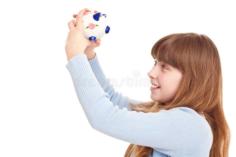 Teenager holding piggybank. Close up, teenager holding piggybank, isolated on white royalty free stock photos