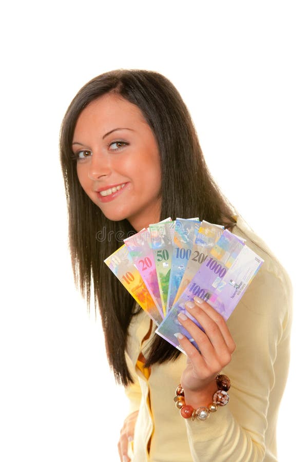 Teenager with Swiss Francs. Smiling long haired teenager showing Swiss Francs currency in fan shape, isolated on white background stock images