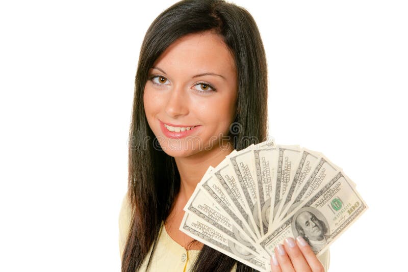 Teenager with wad of dollars. Smiling female teenager holding wad of dollar bill banknotes in fan shape, isolated on white background stock photo